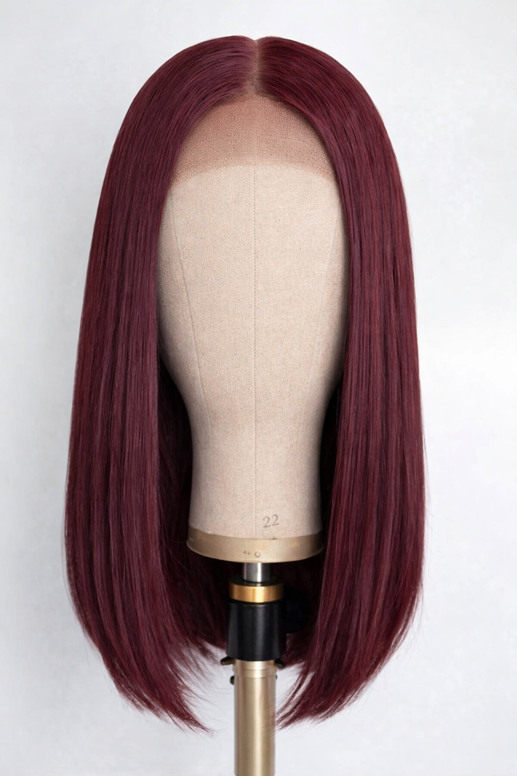 Lifestyle view of model wearing burgundy straight glueless human hair wig