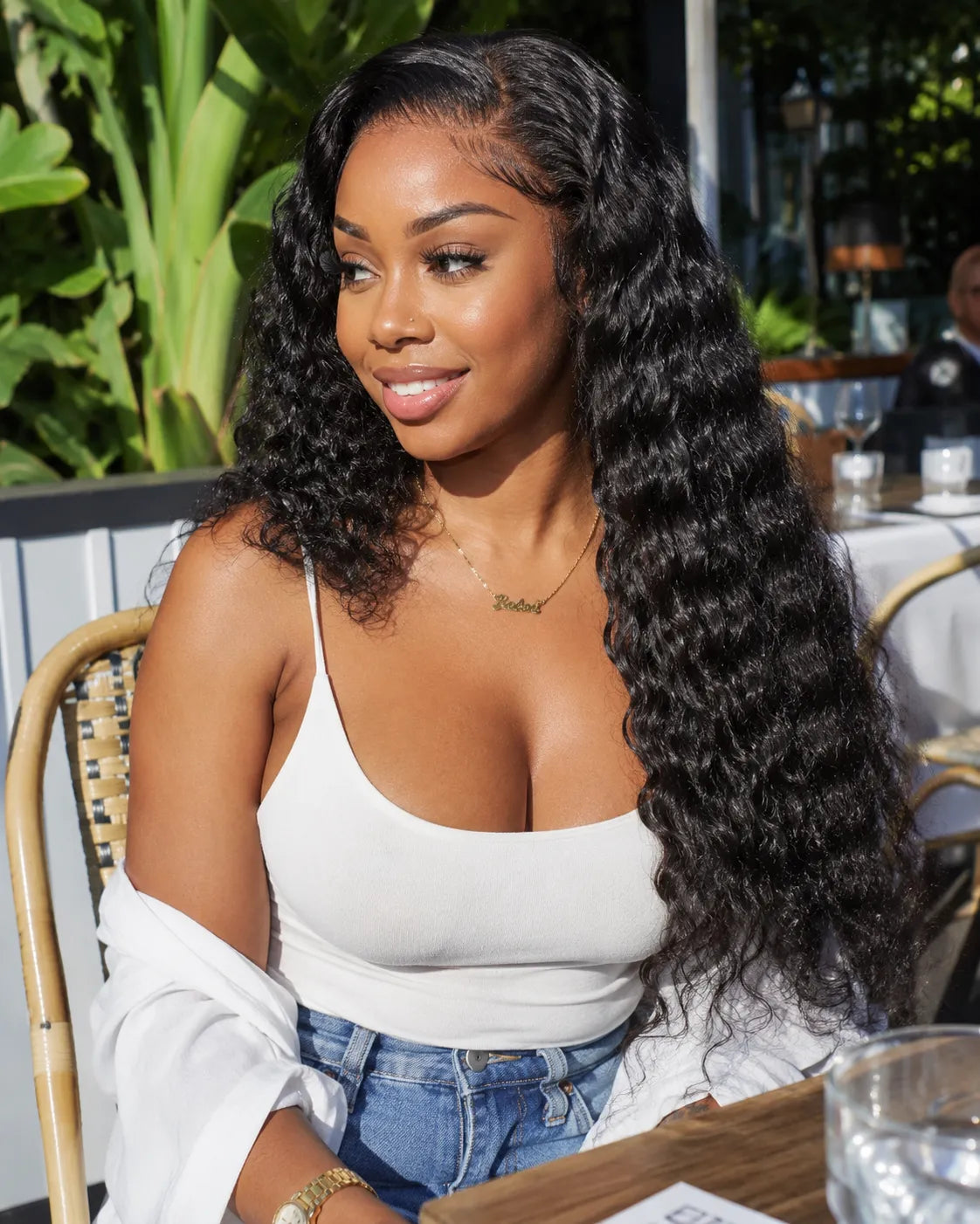 Side view of deep wave lace wig showing natural hairline with soft texture and natural finish
