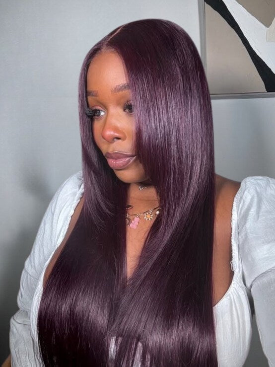 Lifestyle view of model wearing black straight glueless human hair wig