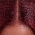 Close-up view of burgundy straight human hair wig texture and lace detail