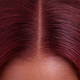 Close-up view of burgundy straight human hair wig texture and lace detail
