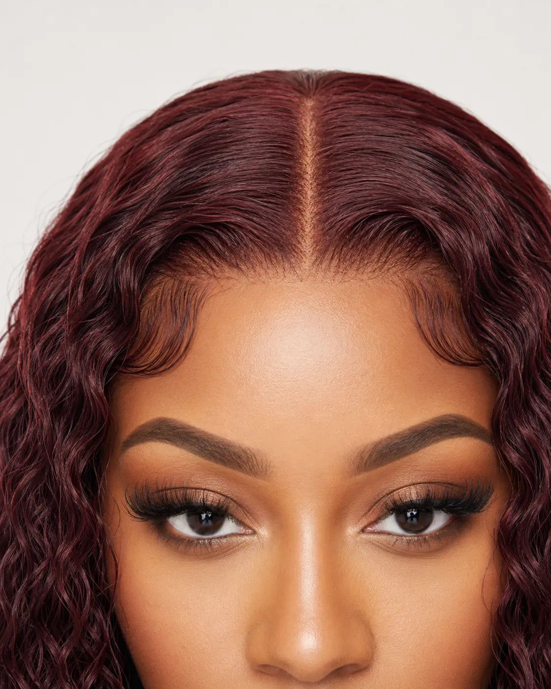 Close-up of natural pre-plucked hairline on burgundy lace front wig