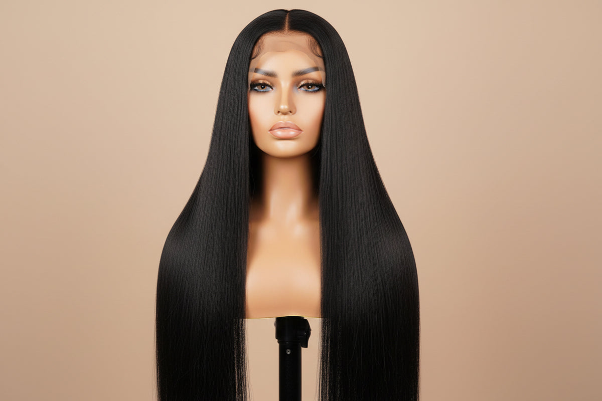 Mannequin head with long black straight wig on a brown background