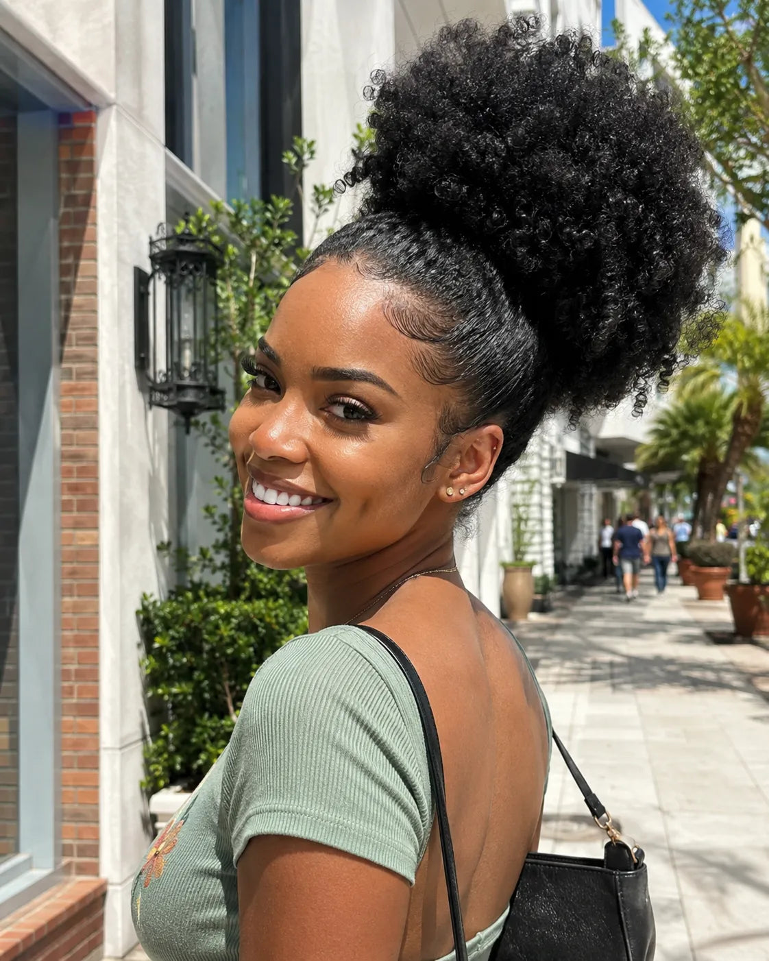 Front view of natural black human hair wig on model with soft texture and natural finish