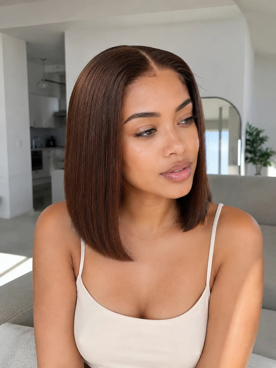 Back view of brown straight human hair wig with natural volume with soft texture and natural finish