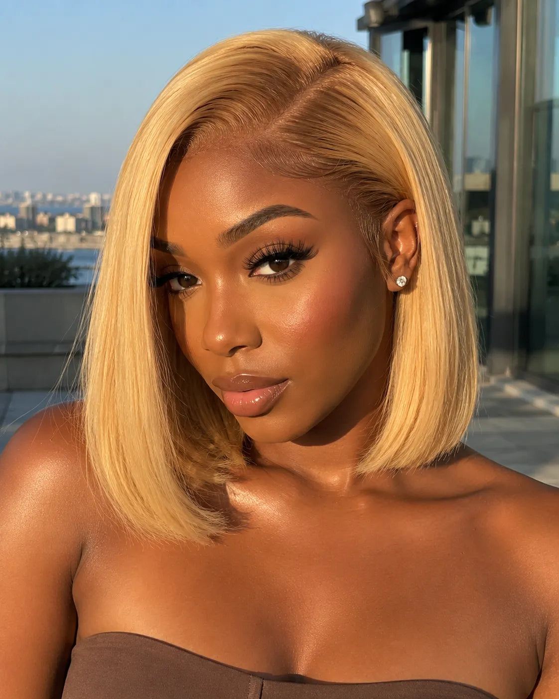 Front view of honey blonde straight lace front human hair wig on model