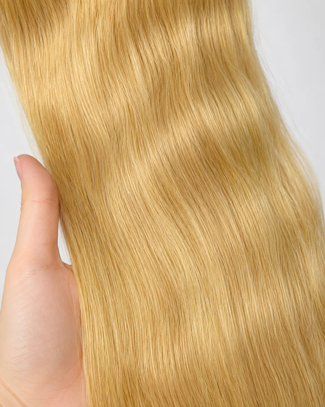 Side view of honey blonde straight lace wig showing natural hairline with soft texture and natural finish