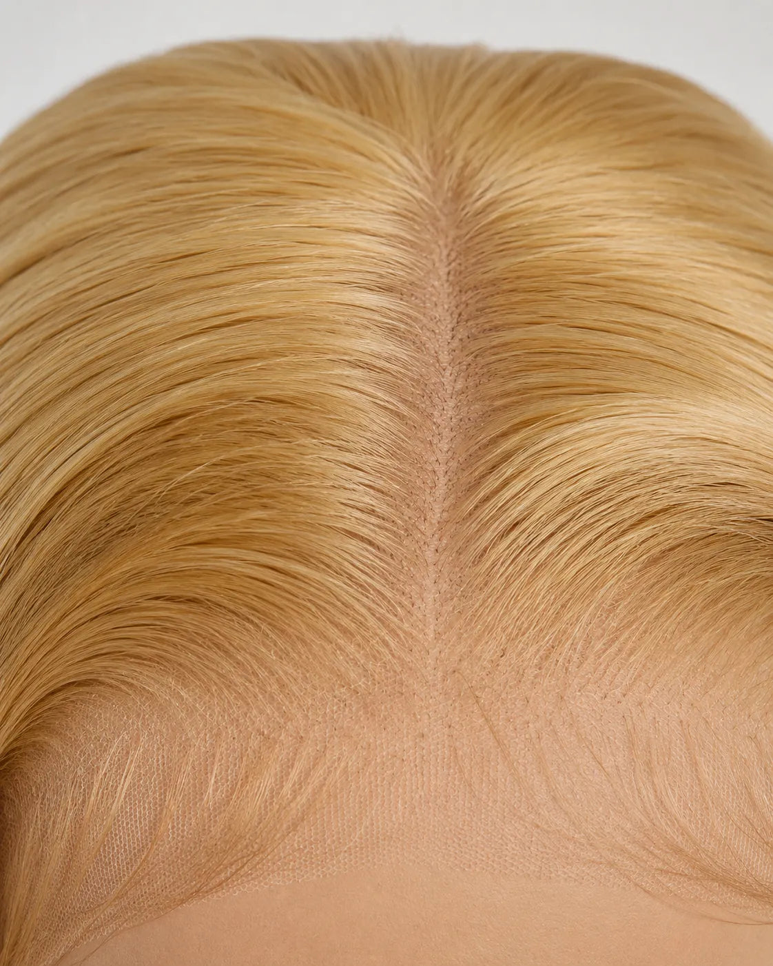 Back view of honey blonde straight human hair wig with natural volume with soft texture and natural finish