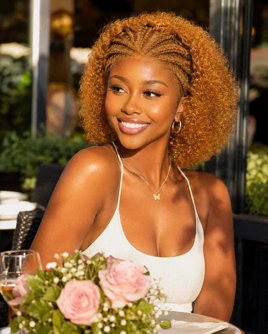 Lifestyle view of model wearing natural black curly glueless human hair wig