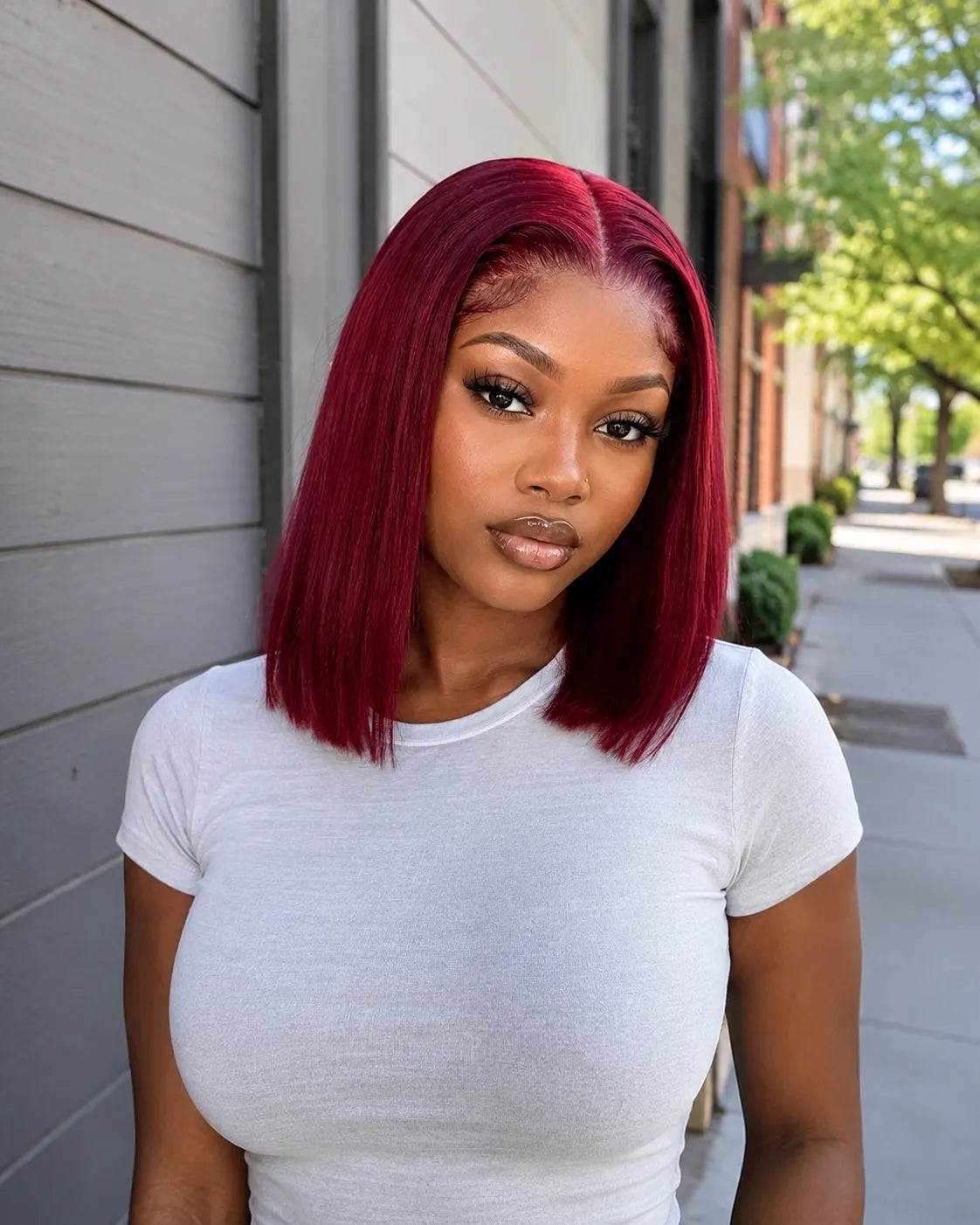 Back view of burgundy straight human hair wig with natural volume with soft texture and natural finish