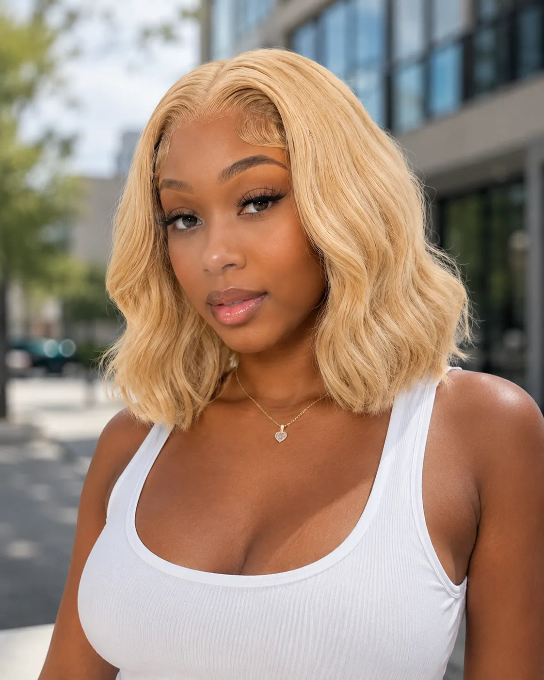 Side view of honey blonde body wave lace wig showing natural hairline with soft texture and natural finish