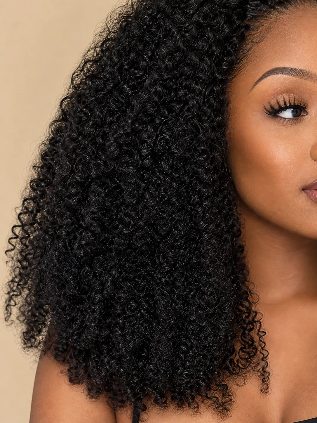 Product detail view of kinky curly human hair wig with soft texture and natural finish
