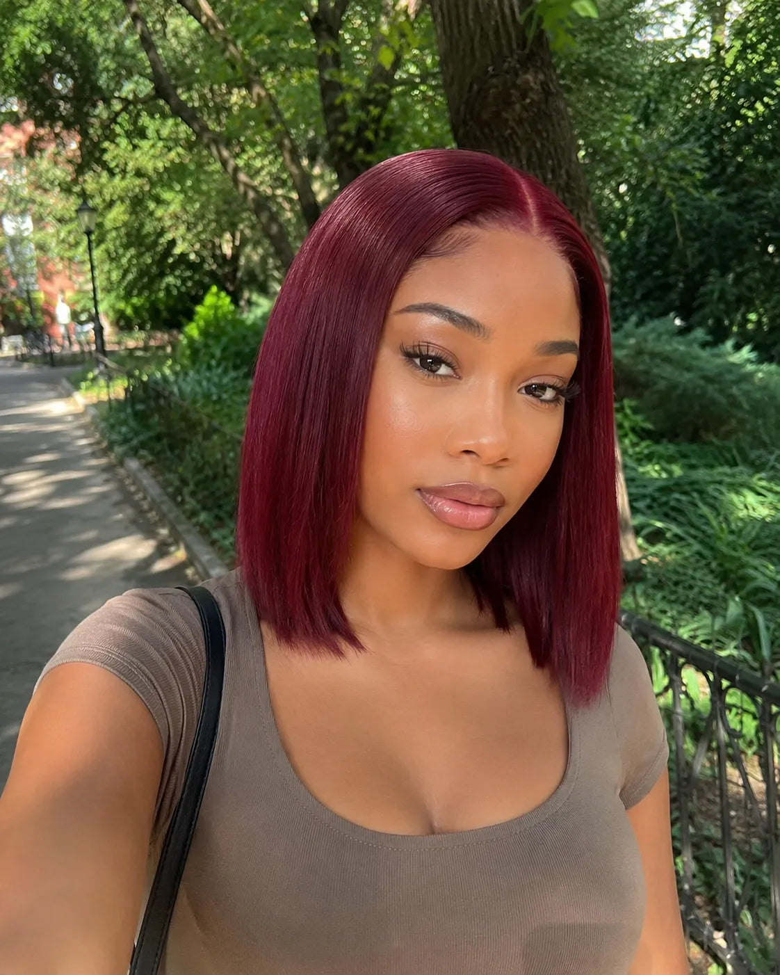 Side view of burgundy straight lace wig showing natural hairline with soft texture and natural finish