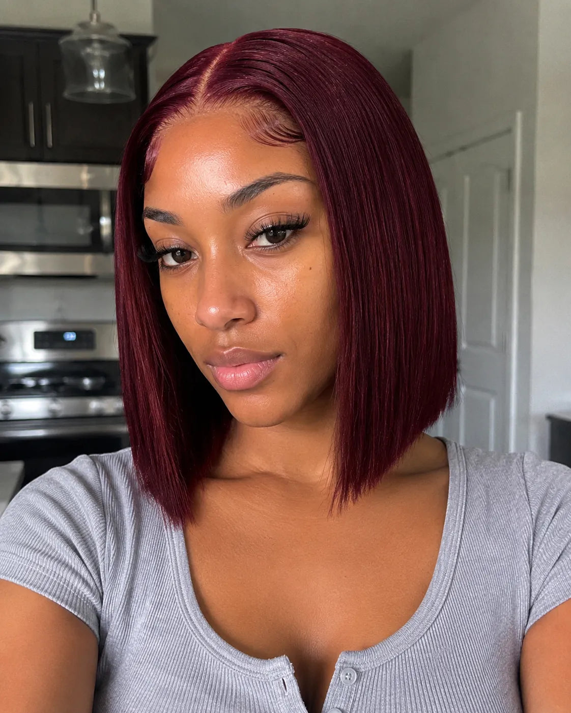 Back view of burgundy straight human hair wig with natural volume with soft texture and natural finish