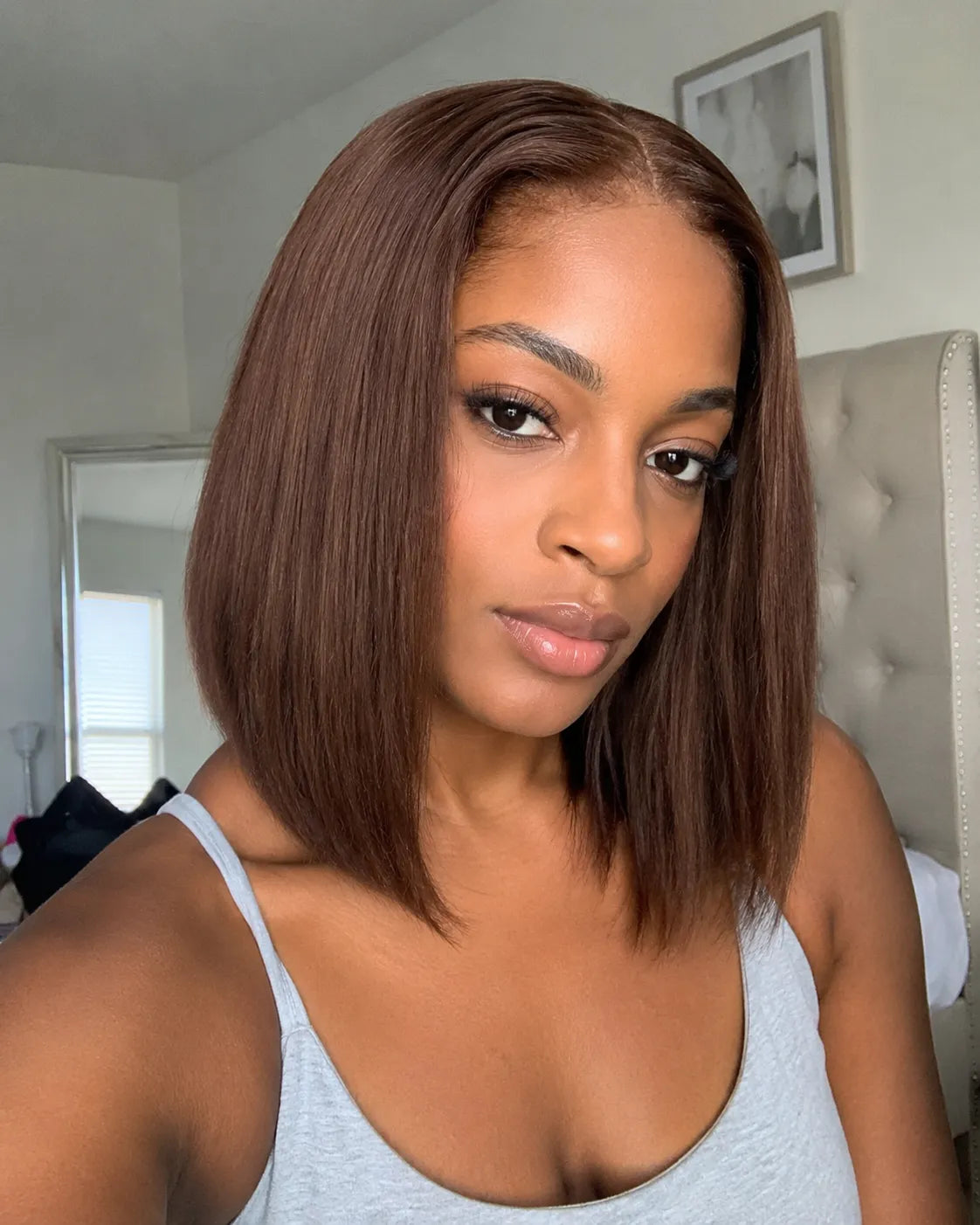 Front view of straight human hair wig on model with soft texture and natural finish