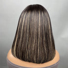 Lifestyle view of model wearing natural black straight glueless human hair wig